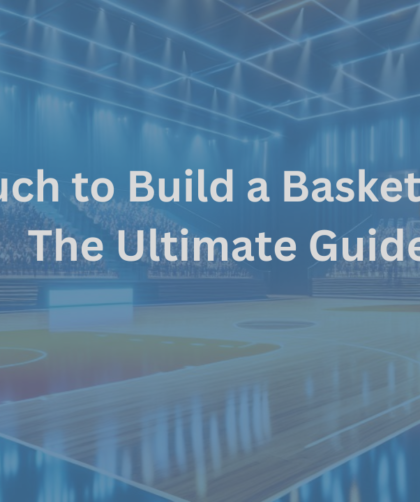 Modern basketball gym interior with a polished wooden court, professional hoops, seating, and bright overhead lights, illustrating the cost considerations for building a basketball gym.