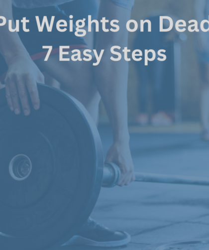 Person loading a weight plate onto a deadlift bar in a gym, preparing for a lift.