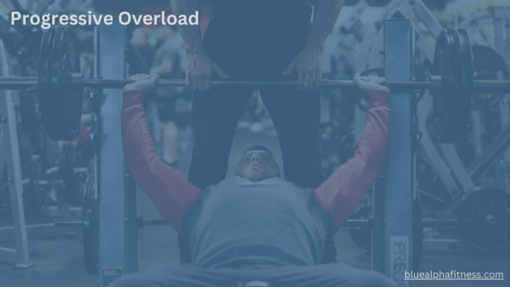 Fitness enthusiast performing a bench press with two plates on each side, showcasing progressive overload in action as they increase weight to build strength and muscle over time.